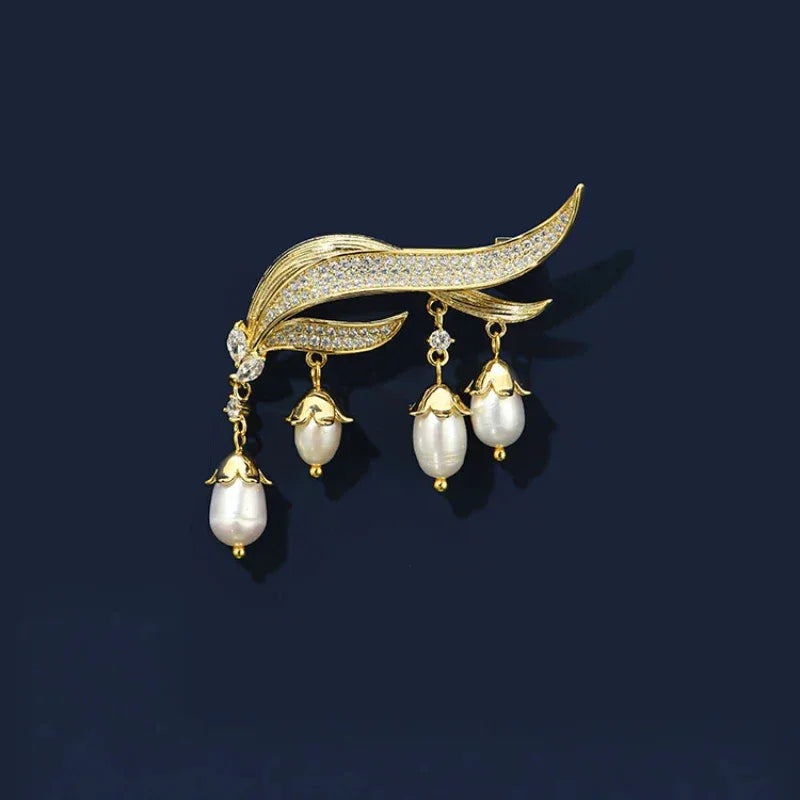 Pearl Lily of the Valley Tassel Brooch — front product view on a dark background