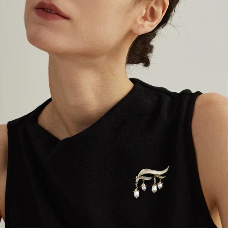 Pearl Lily of the Valley Tassel Brooch — brooch worn on a black sleeveless neckline
