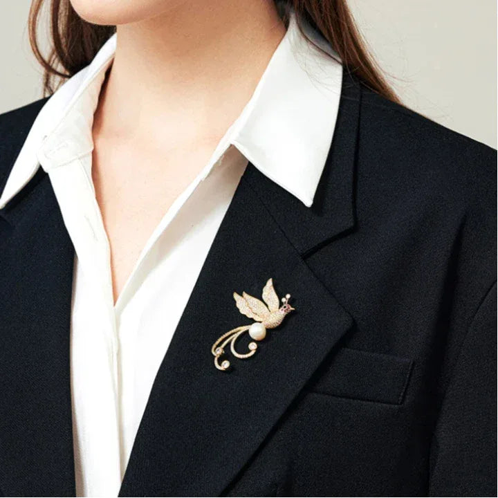 Pearl Phoenix Brooch — close blazer-worn view showing scale showing design and scale