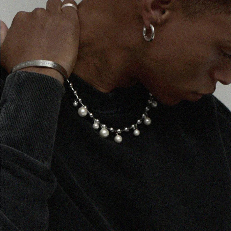 Steel Chain Necklace with Pearl Drops — side portrait with a hand behind the neck
