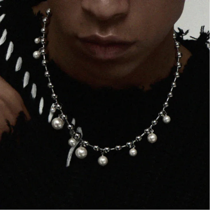 Steel Chain Necklace with Pearl Drops — front neckline-worn portrait over a black open-knit top