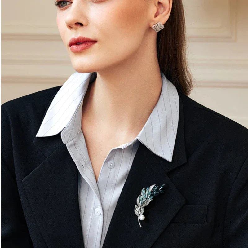 Blue Wheat Sprig Pearl Brooch — waist-up model portrait showing scale