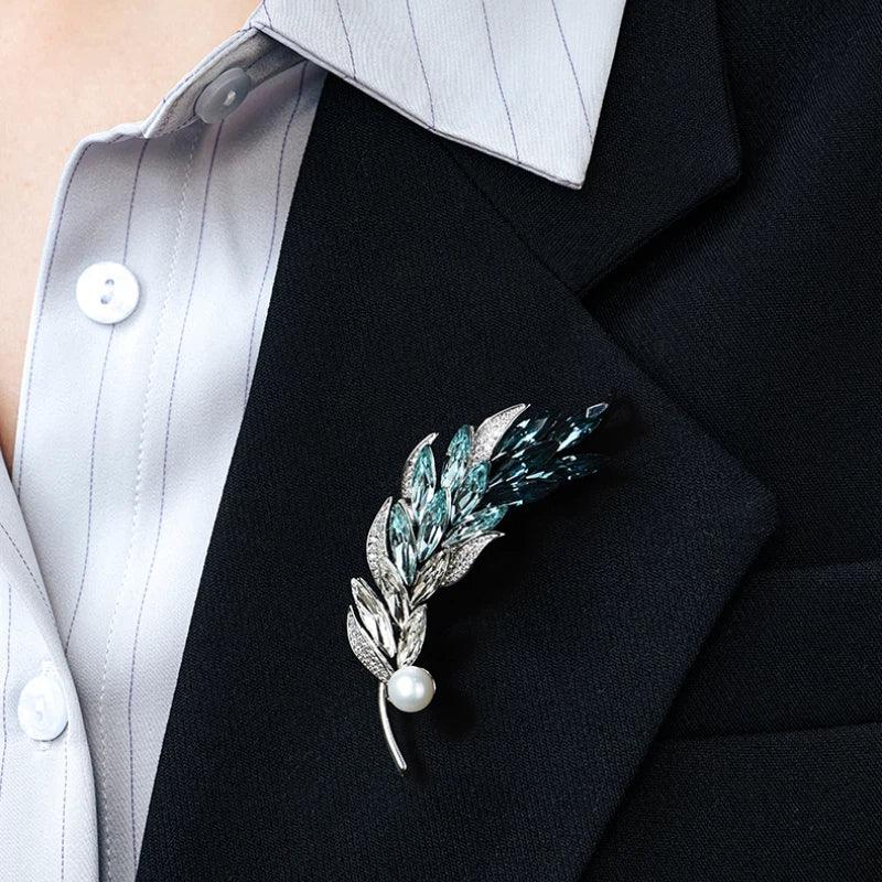 Blue Wheat Sprig Pearl Brooch — close blazer-worn view showing the brooch vertically at the lapel