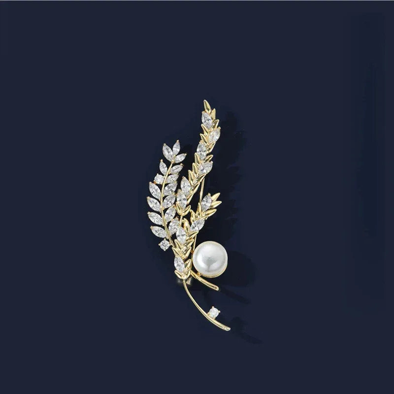 Pearl Wheat Sprig Brooch — front product view on a dark background