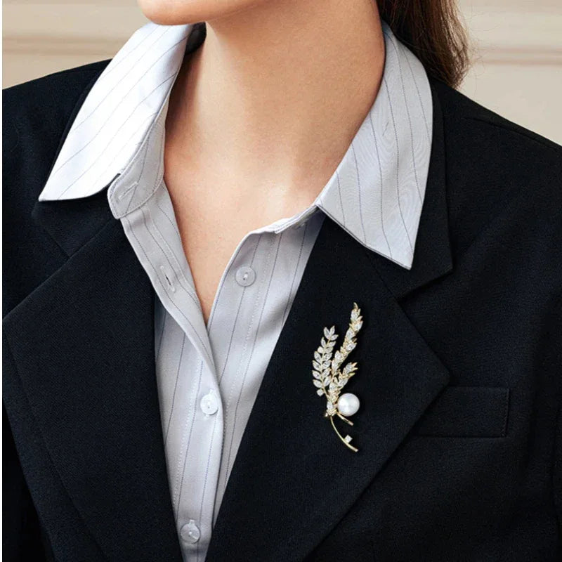 Pearl Wheat Sprig Brooch — close blazer-worn view showing the upright brooch
