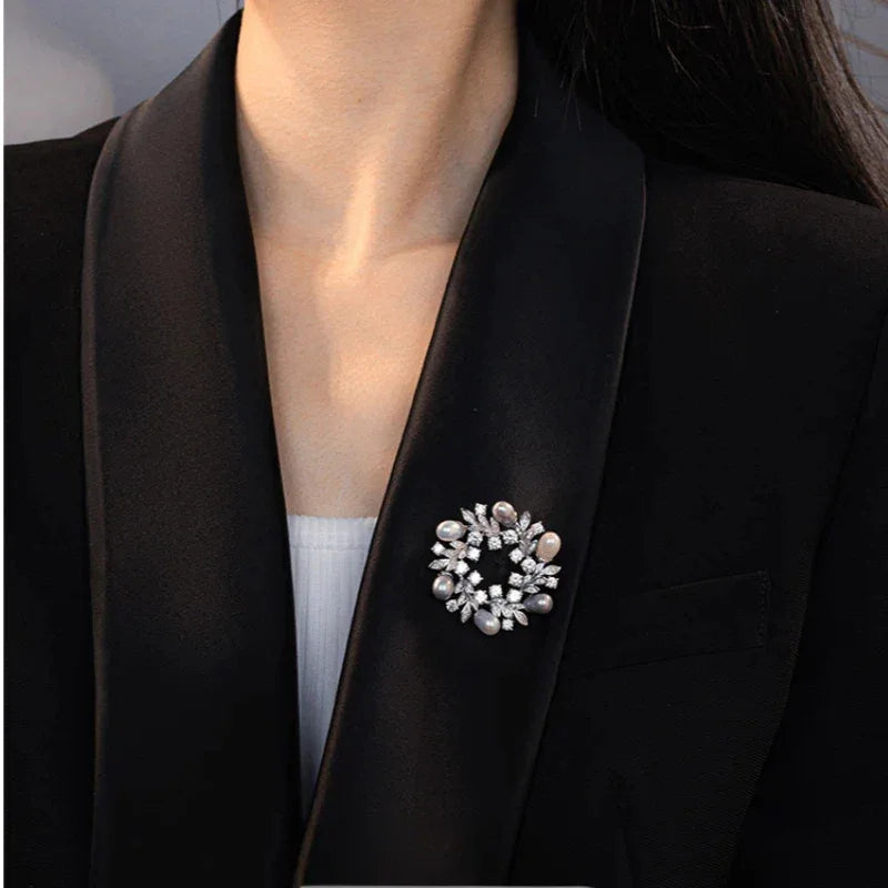 Pearl and Cubic Zirconia Olive Leaf Wreath Brooch — second black-blazer worn view