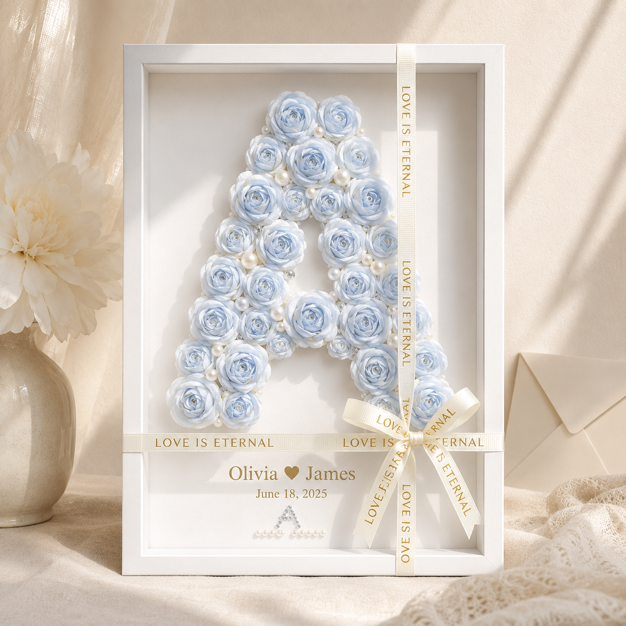 Personalized blue paper rose monogram shadow box displaying letter A formed from hand-rolled dusty blue and ivory roses
