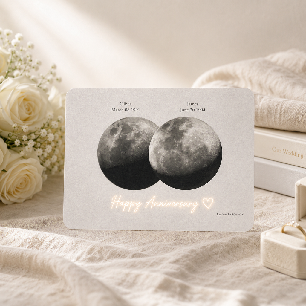 Personalized overlapping double moon phase hidden message film card displayed on cream linen surface beside white roses