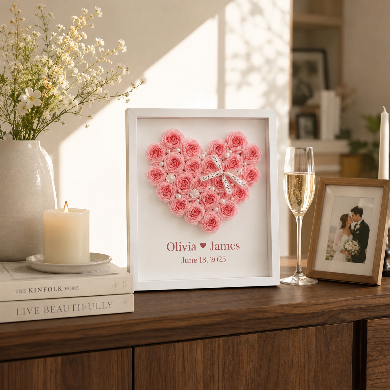 Lifestyle flat lay of personalized paper rose heart anniversary frame surrounded by wedding invitation love letter