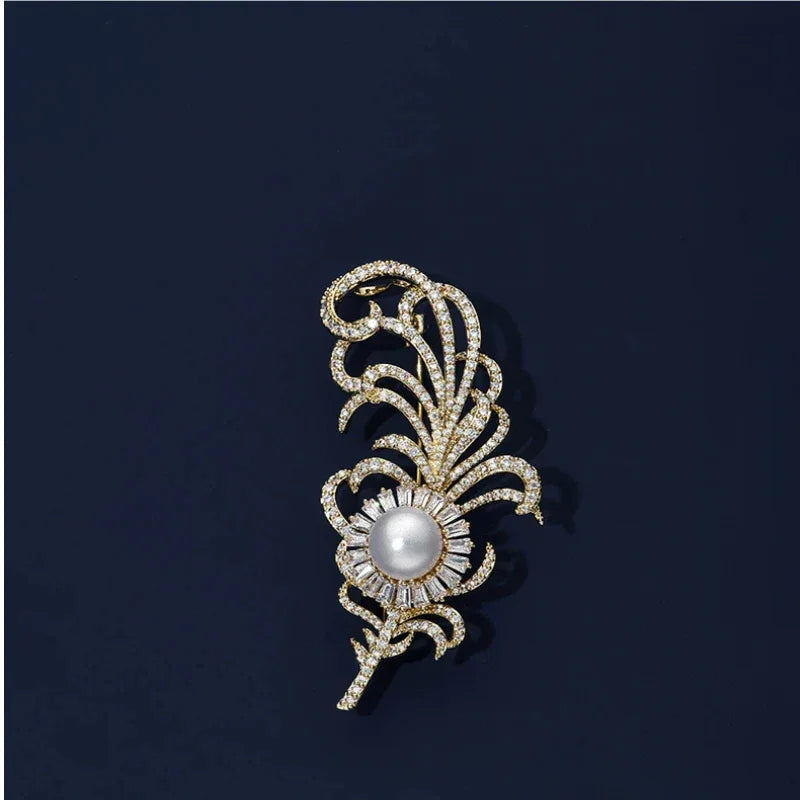 Pearl Phoenix Feather Brooch — front product view on a dark background