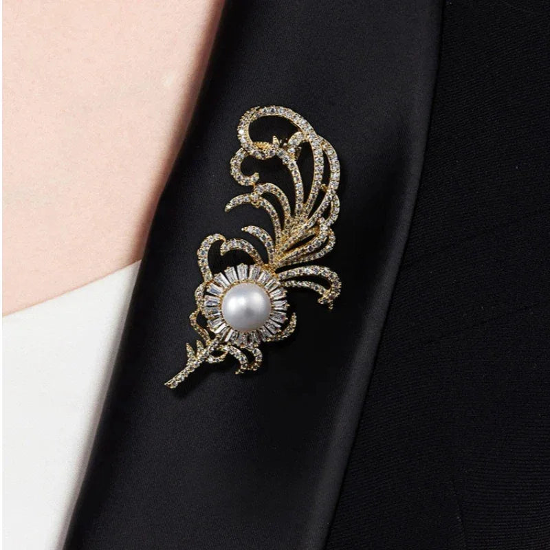 Pearl Phoenix Feather Brooch — close blazer-worn view showing scale