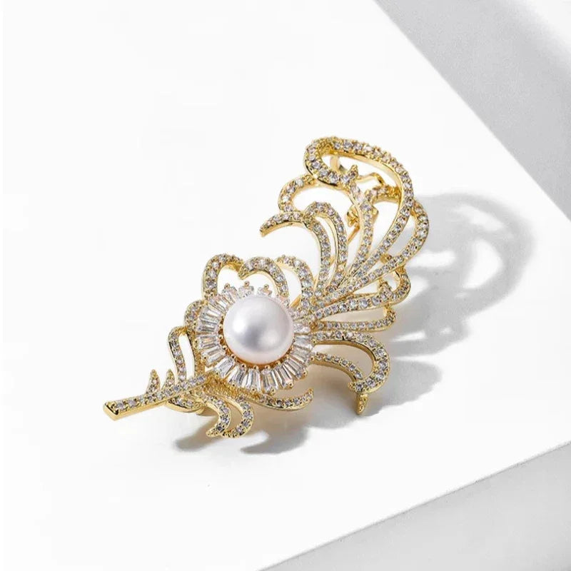 Pearl Phoenix Feather Brooch — angled product view on white showing design and scale