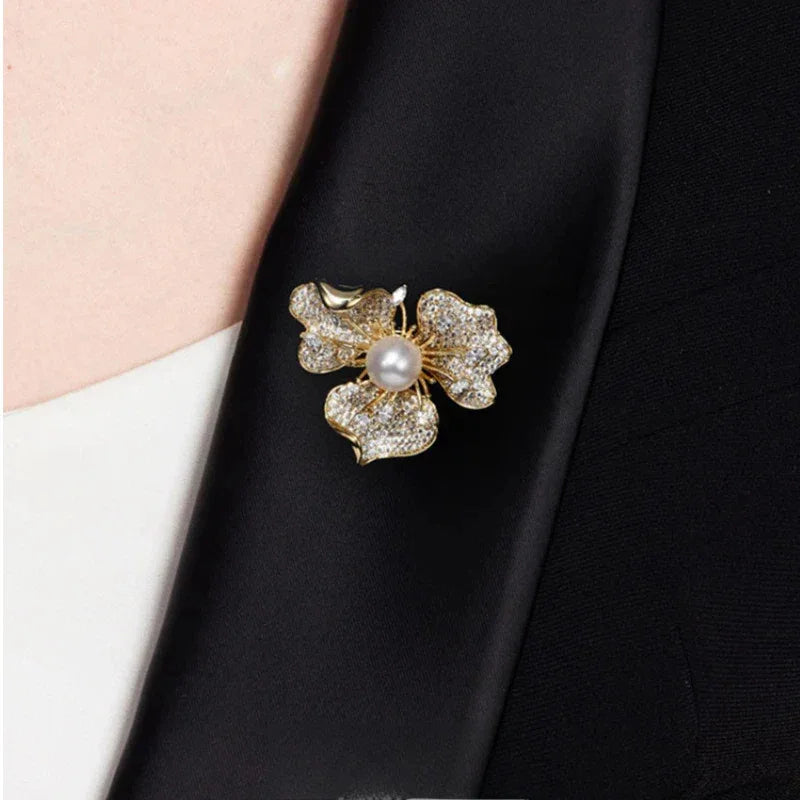 Pearl and Cubic Zirconia Plum Blossom Brooch — close blazer-worn view showing the brooch at the lapel