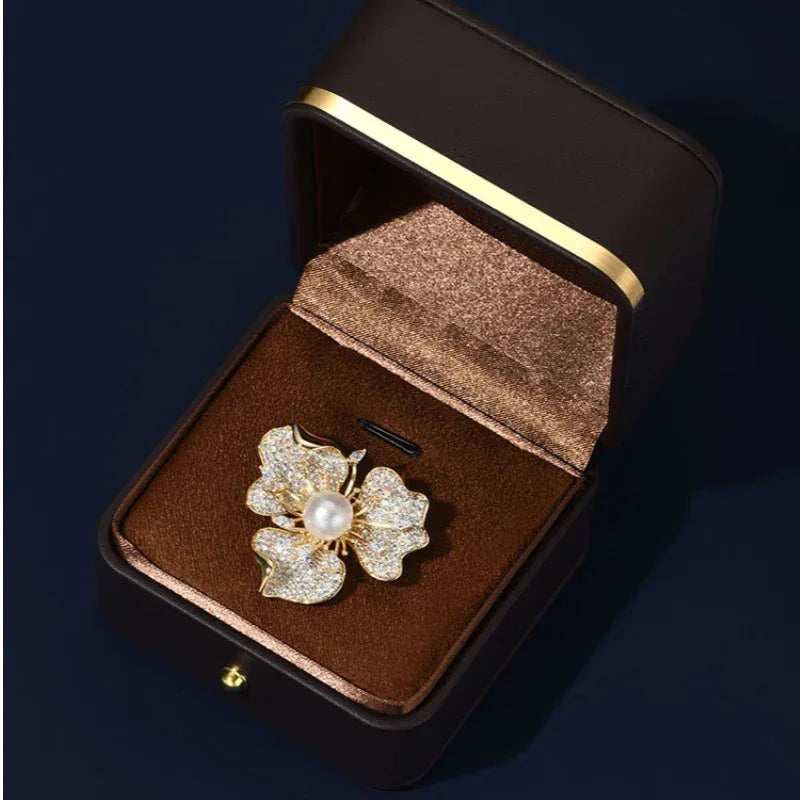 Pearl and Cubic Zirconia Plum Blossom Brooch — brooch displayed inside a jewelry gift box