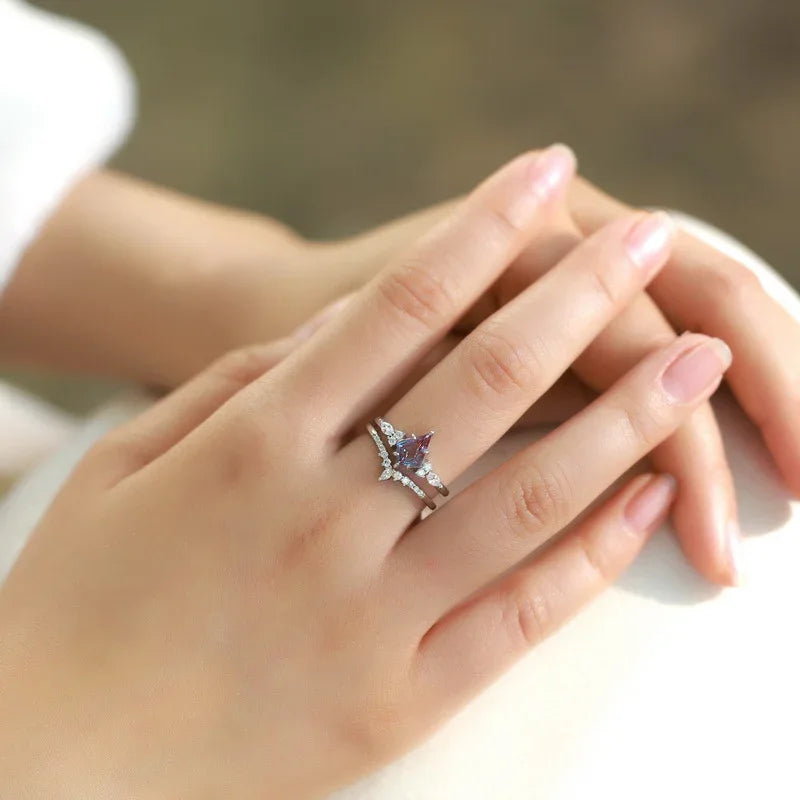Princess-cut Alexandrite two-band ring with clear accents, shown worn in a close lifestyle view