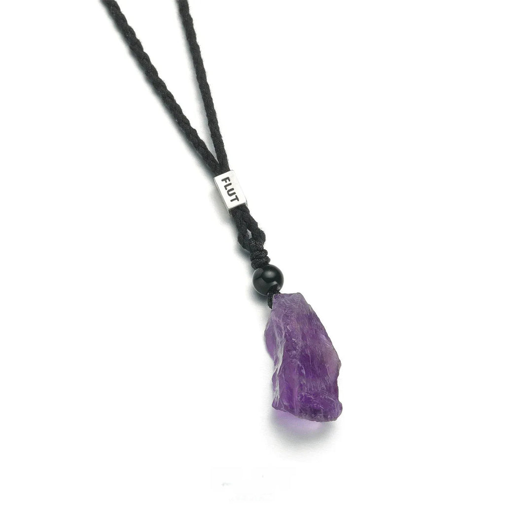 raw amethyst crystal cord necklace crystal point and bead detail on white