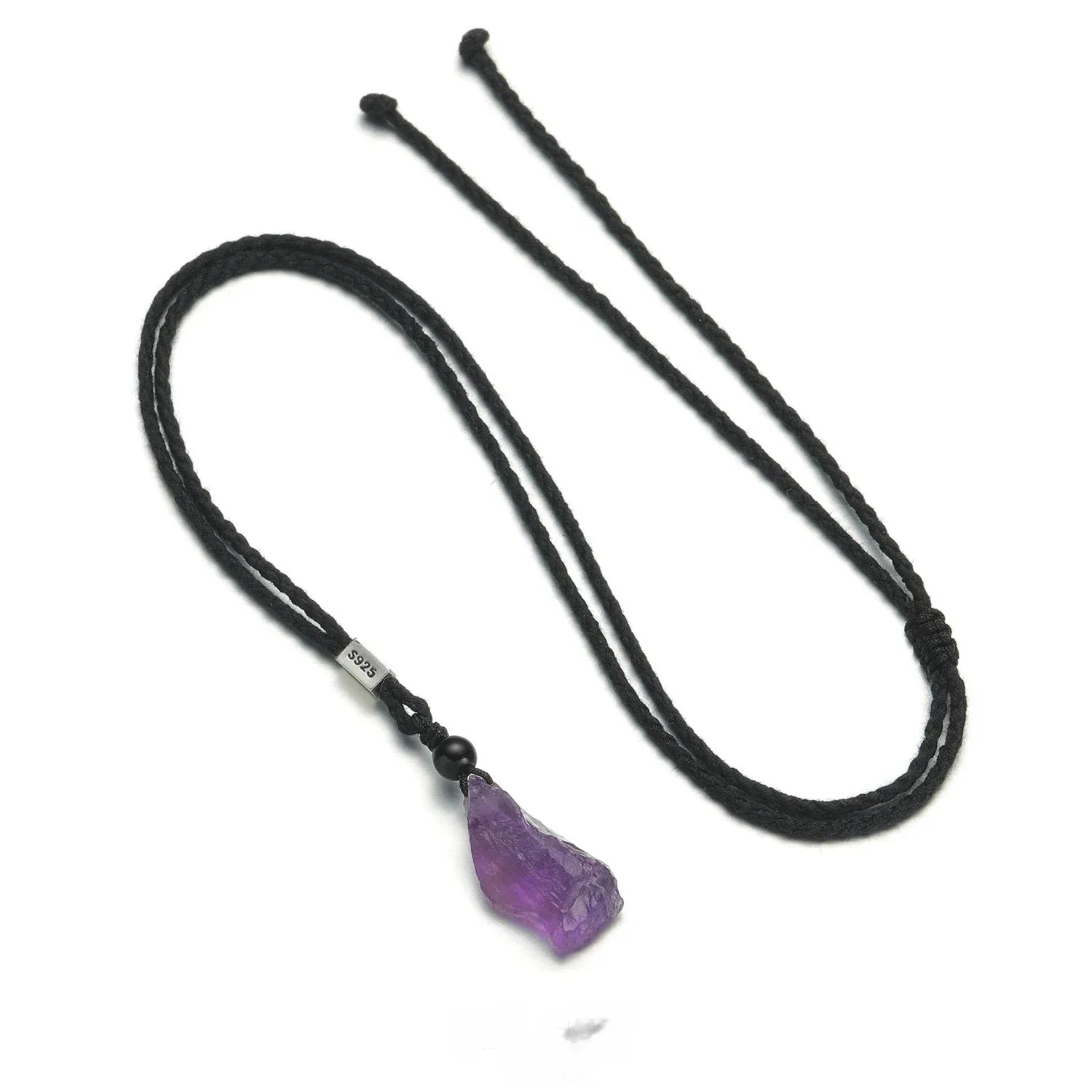raw amethyst crystal cord necklace necklace laid flat on a white background