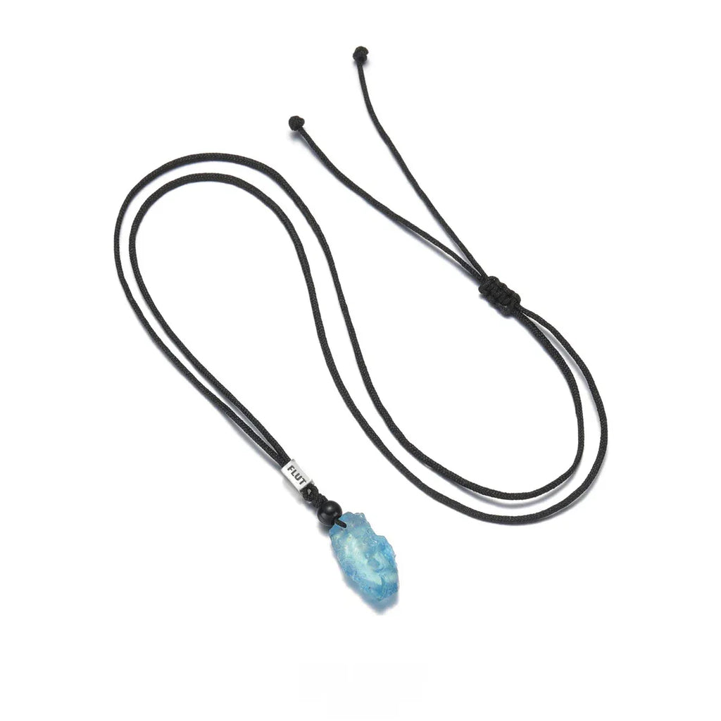 Raw Aquamarine Cord Pendant Necklace pendant and chain detail on a light background