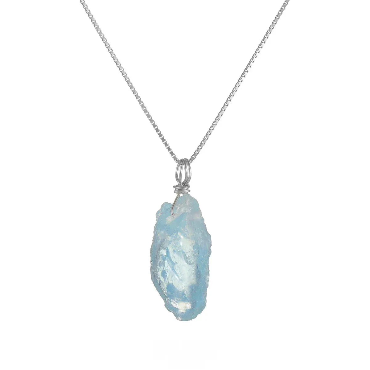 Raw Aquamarine Pendant Necklace pendant and chain detail on a light background