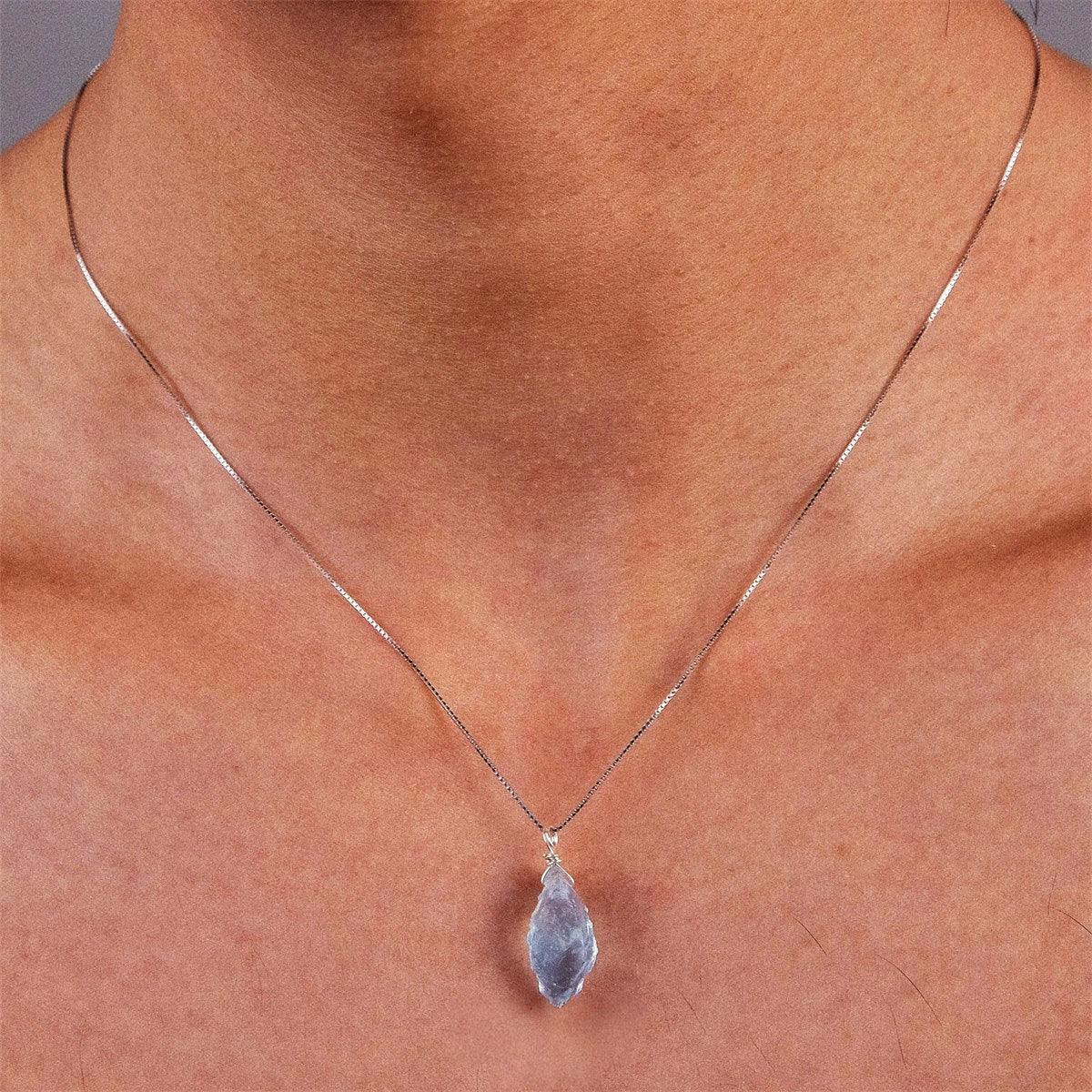 Raw Aquamarine Pendant Necklace worn at the neckline in a close-up