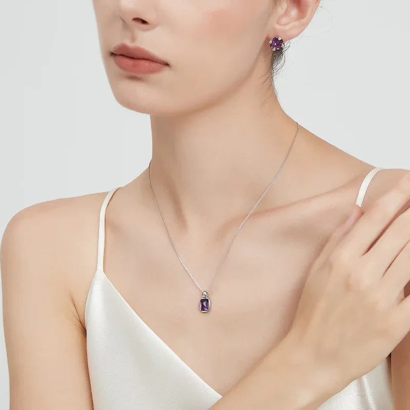 rectangular amethyst pendant necklace worn at the neckline in a portrait