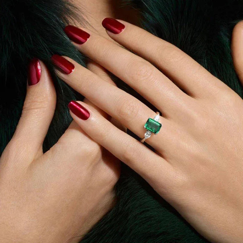 Rectangular Emerald Adjustable Ring worn on the hand from a second angle