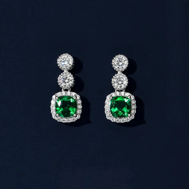 Rectangular Emerald Drop Earrings styled ear view showing scale