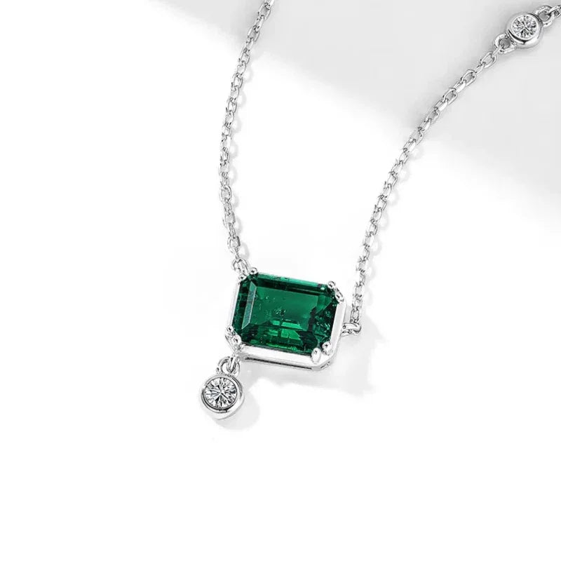 Rectangular Emerald Drop Pendant Necklace pendant and chain detail on white
