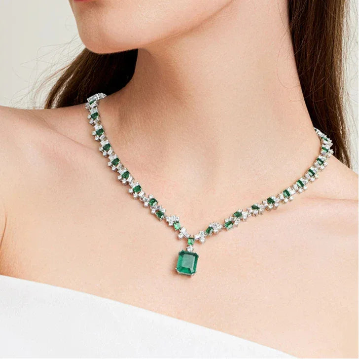Rectangular Emerald Graduated Tennis Necklace worn at the neckline in a close-up