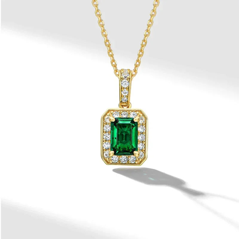 Rectangular Emerald Halo Pendant Necklace pendant and chain detail on white