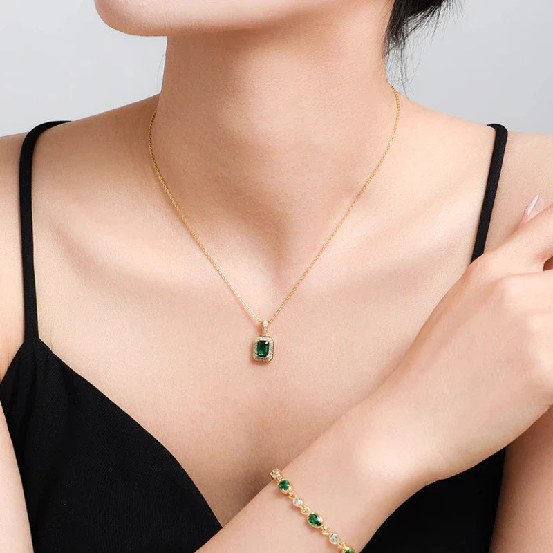 Rectangular Emerald Halo Pendant Necklace worn at the neckline from a second angle