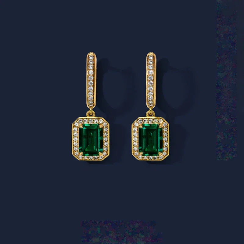 Rectangular Emerald Long Drop Earrings paired product view on a dark background