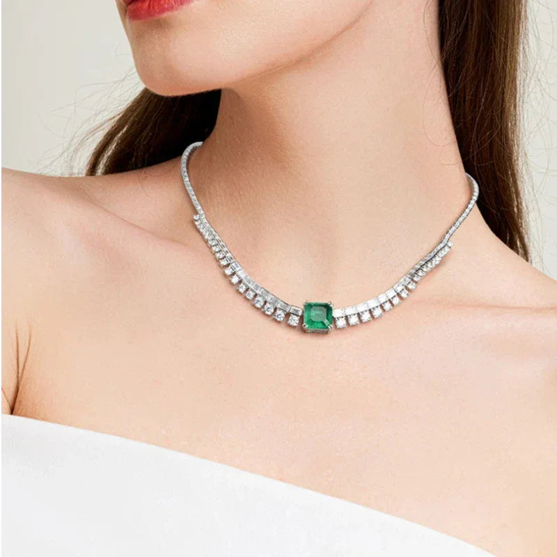 Rectangular Emerald Tennis Necklace worn at the neckline in a close-up