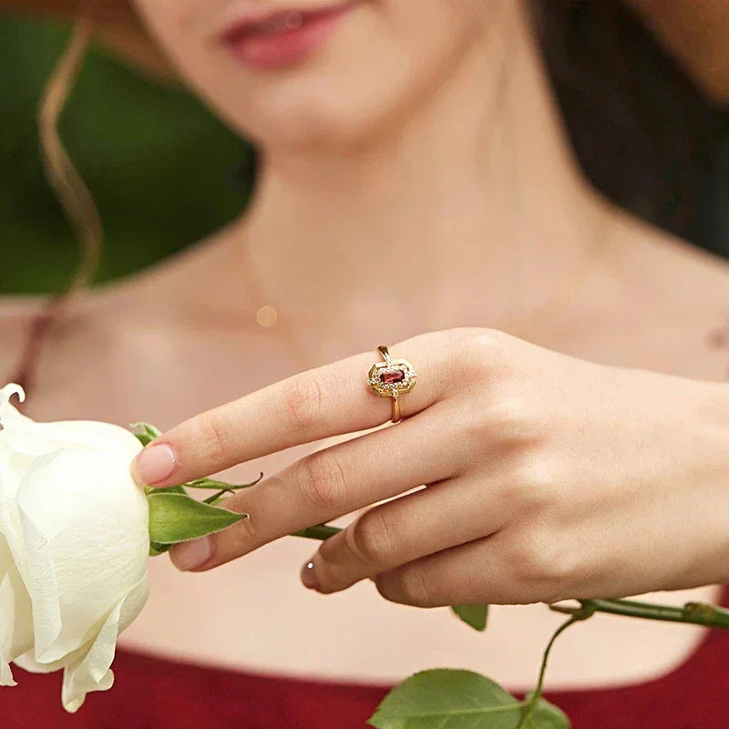 Rectangular Garnet Geometric Adjustable Ring worn on the hand in a close-up