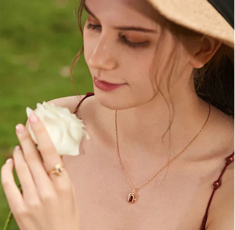 Rectangular Garnet Openwork Pendant Necklace worn at the neckline from a second angle