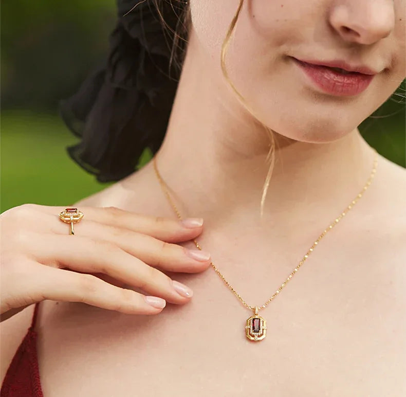 Rectangular Garnet Openwork Pendant Necklace worn at the neckline in a close-up