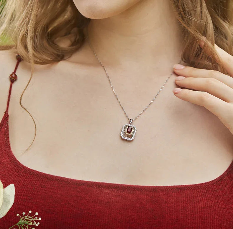 Rectangular Garnet Shield Pendant Necklace worn at the neckline in a close-up