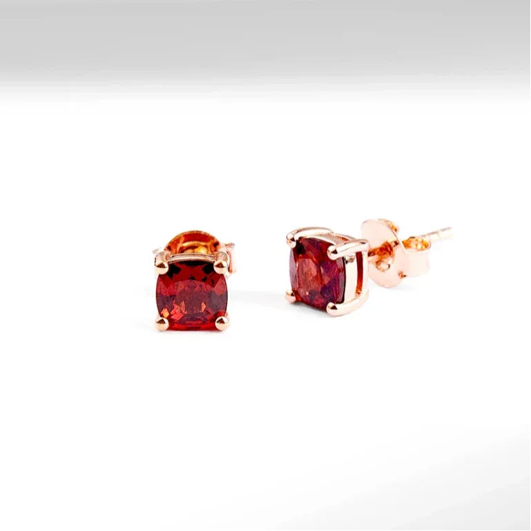 Rectangular Garnet Stud Earrings angled product detail on a jewelry display