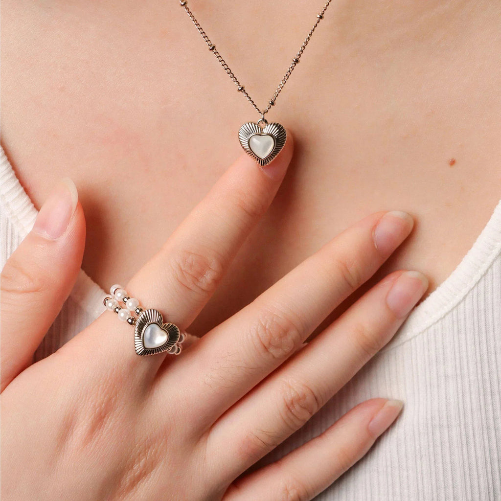 Triple-Row Pearl Heart Stretch Ring — coordinated worn view with a heart necklace