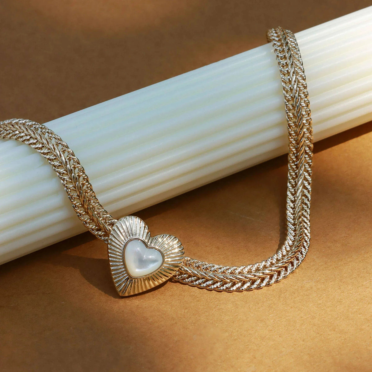 Double-Chain Pearl Heart Necklace — macro view of the layered chain texture and heart setting