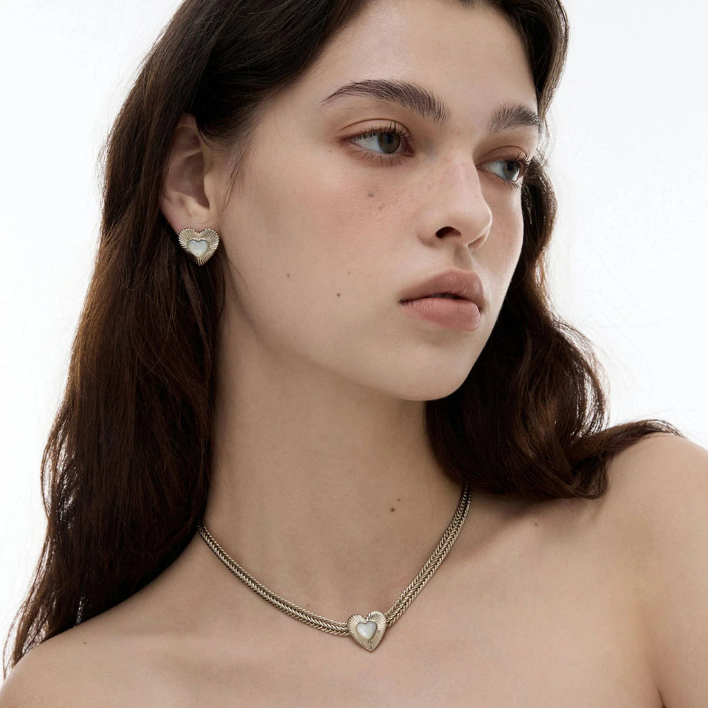 Double-Chain Pearl Heart Necklace — side portrait wearing the necklace