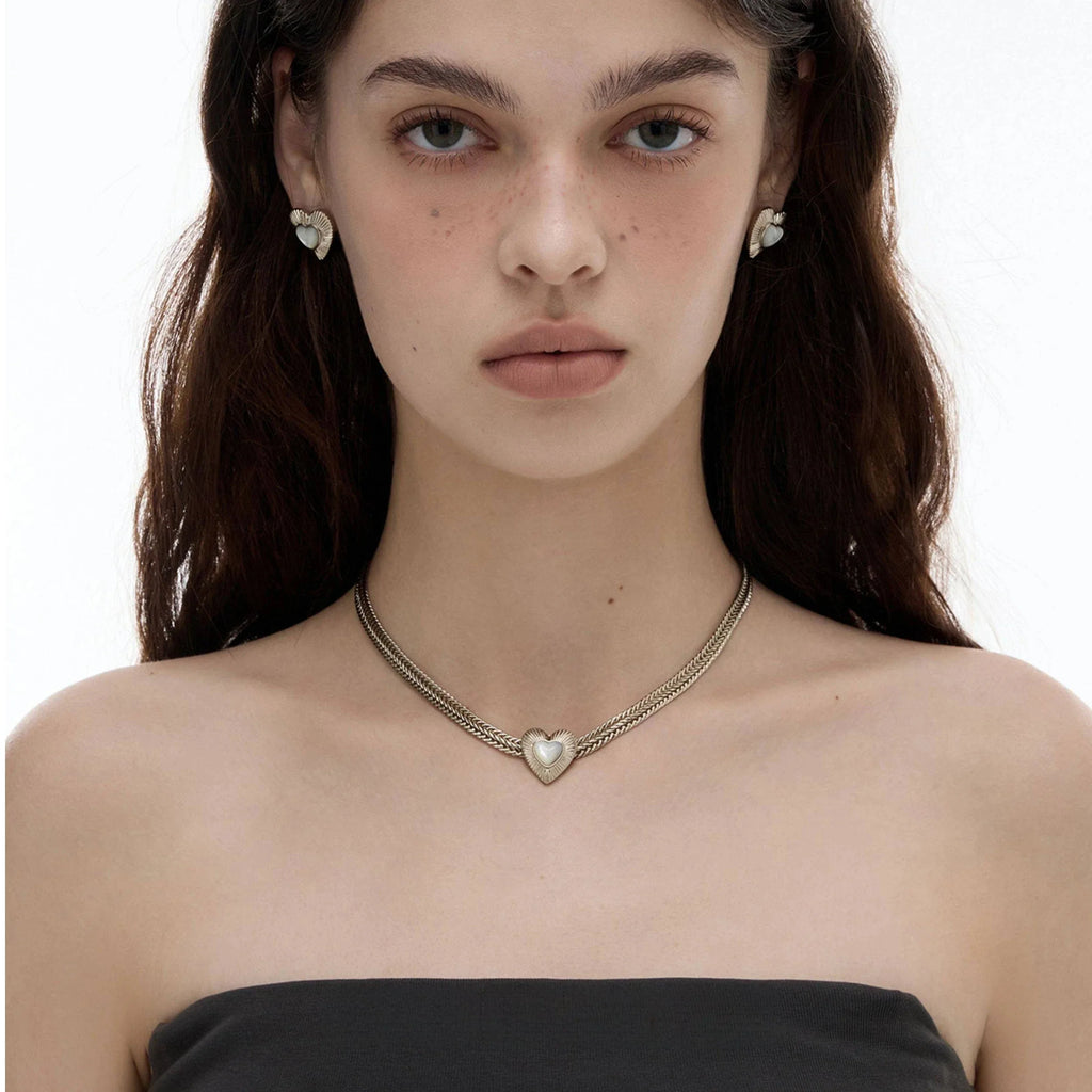 Double-Chain Pearl Heart Necklace — front model portrait showing the close collar fit
