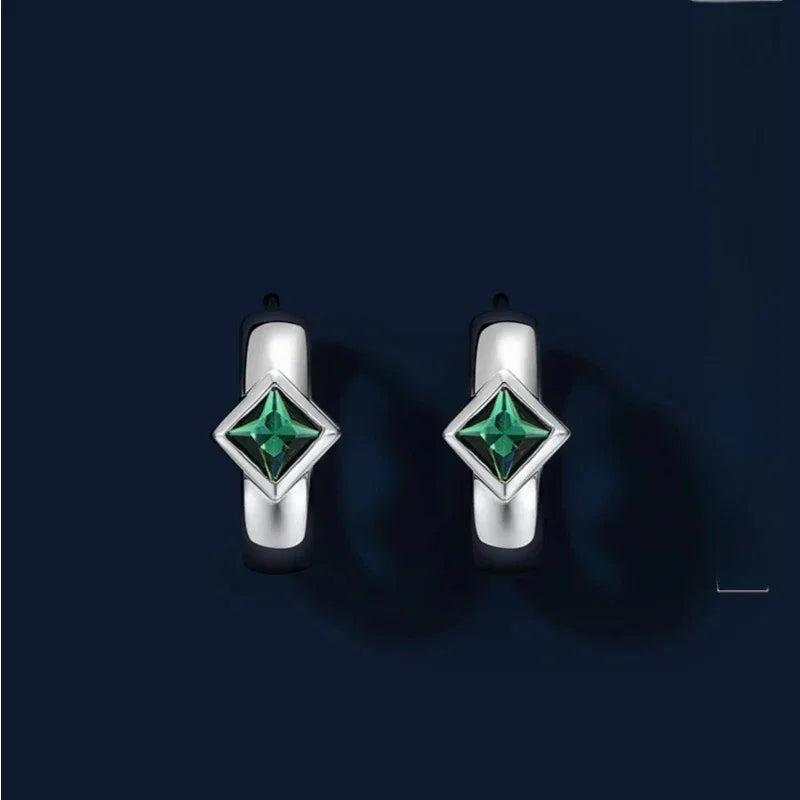 Rhombus Emerald Huggie Hoop Earrings paired product view on a dark background