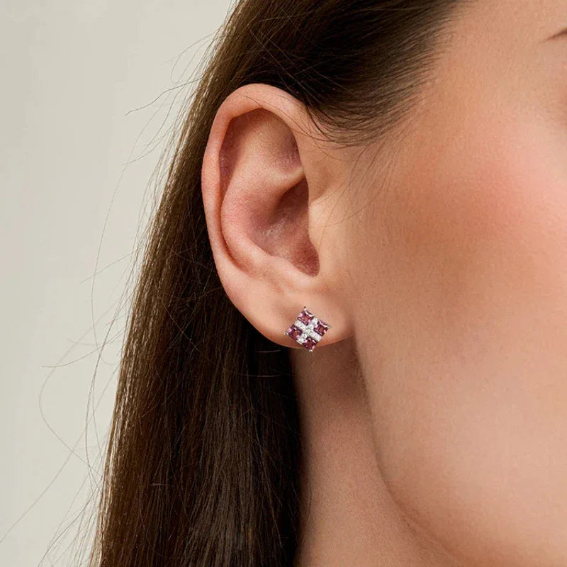 Rose-Purple Garnet Geometric Stud Earrings worn on the hand from a second angle