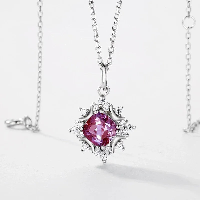 Round Alexandrite starburst pendant necklace, pink-toned Alexandrite view under alternate lighting