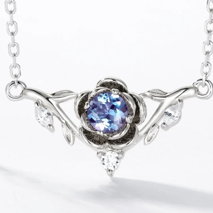 Round Alexandrite wing collar necklace, close-up showing the setting and decorative accents