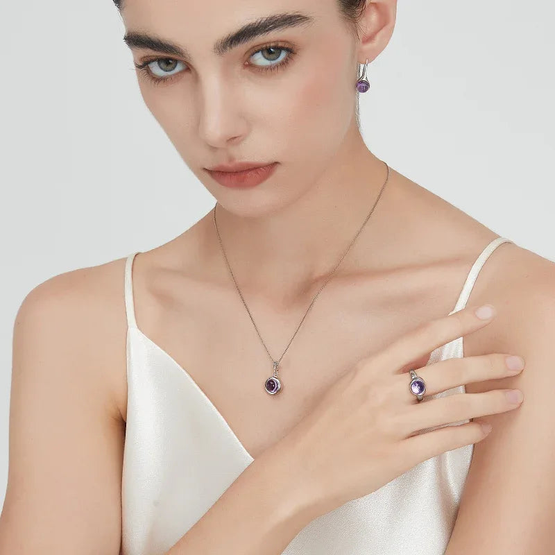 round amethyst bezel pendant necklace second neckline view in soft light