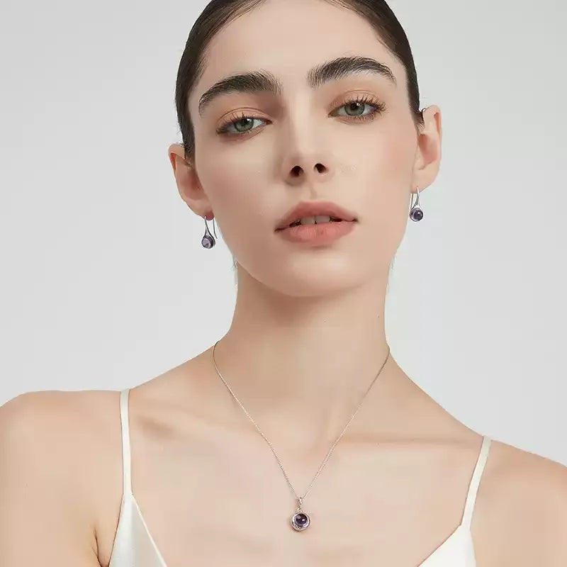 round amethyst bezel pendant necklace styled model view showing pendant scale