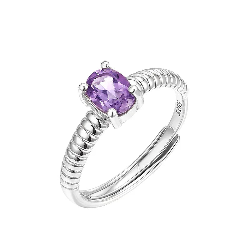 round amethyst open ring worn detail beside the face