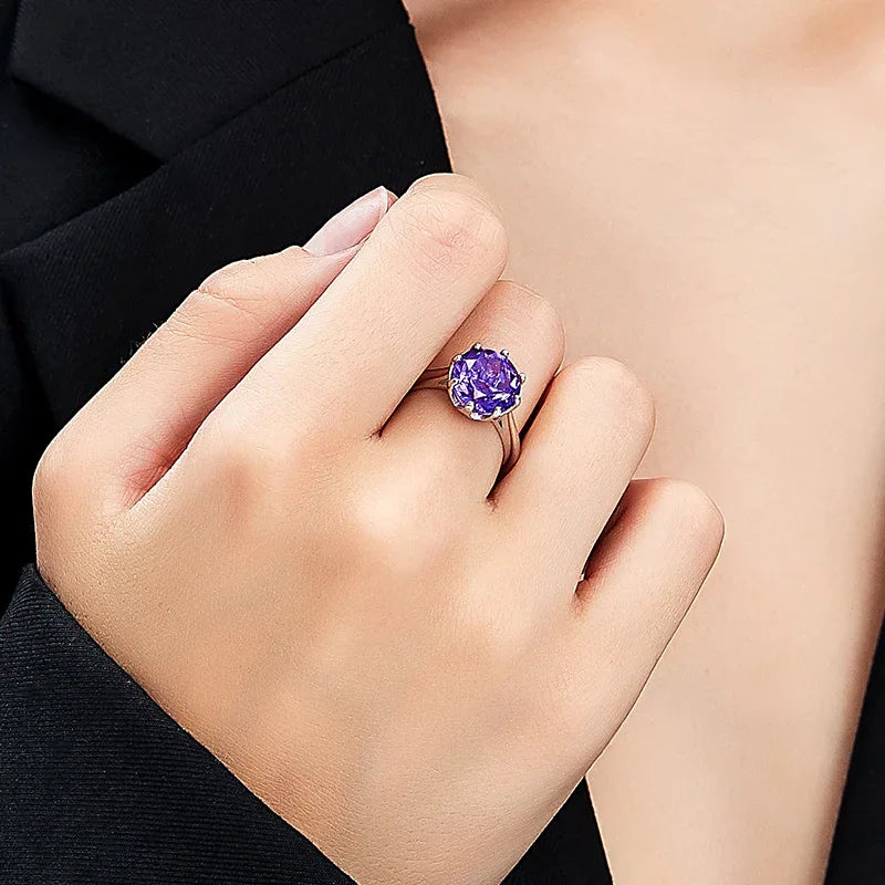 round amethyst solitaire ring styled portrait showing the ring for scale